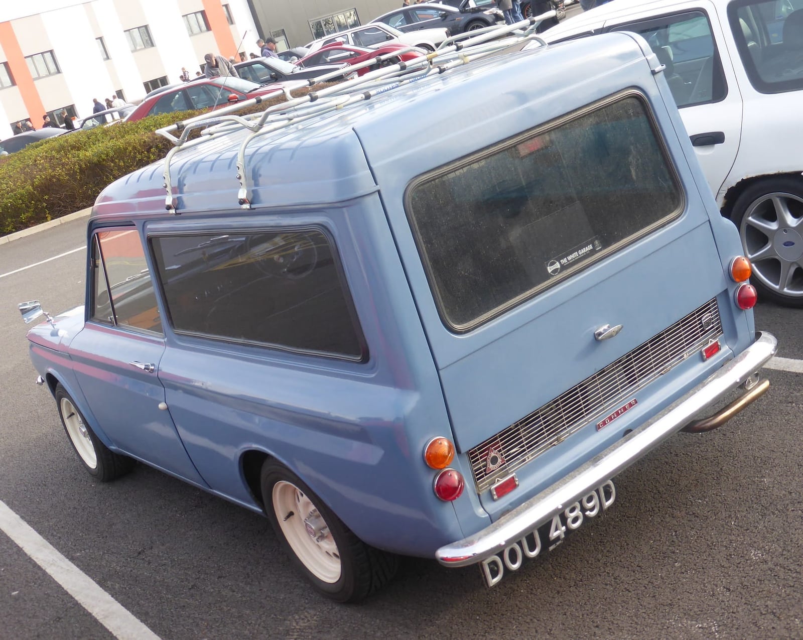 A pale blue 1966 Commer Imp van with roof rack, rear three-quarter view