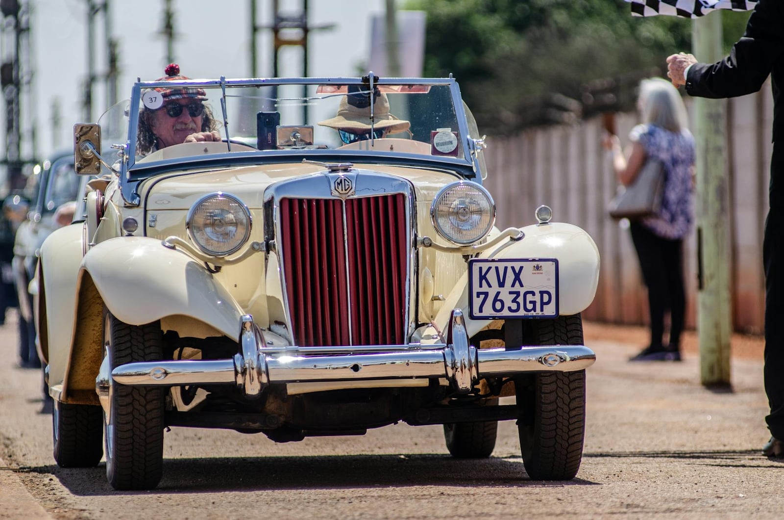 A cream MG TD on a classic car run, front three-quarter view