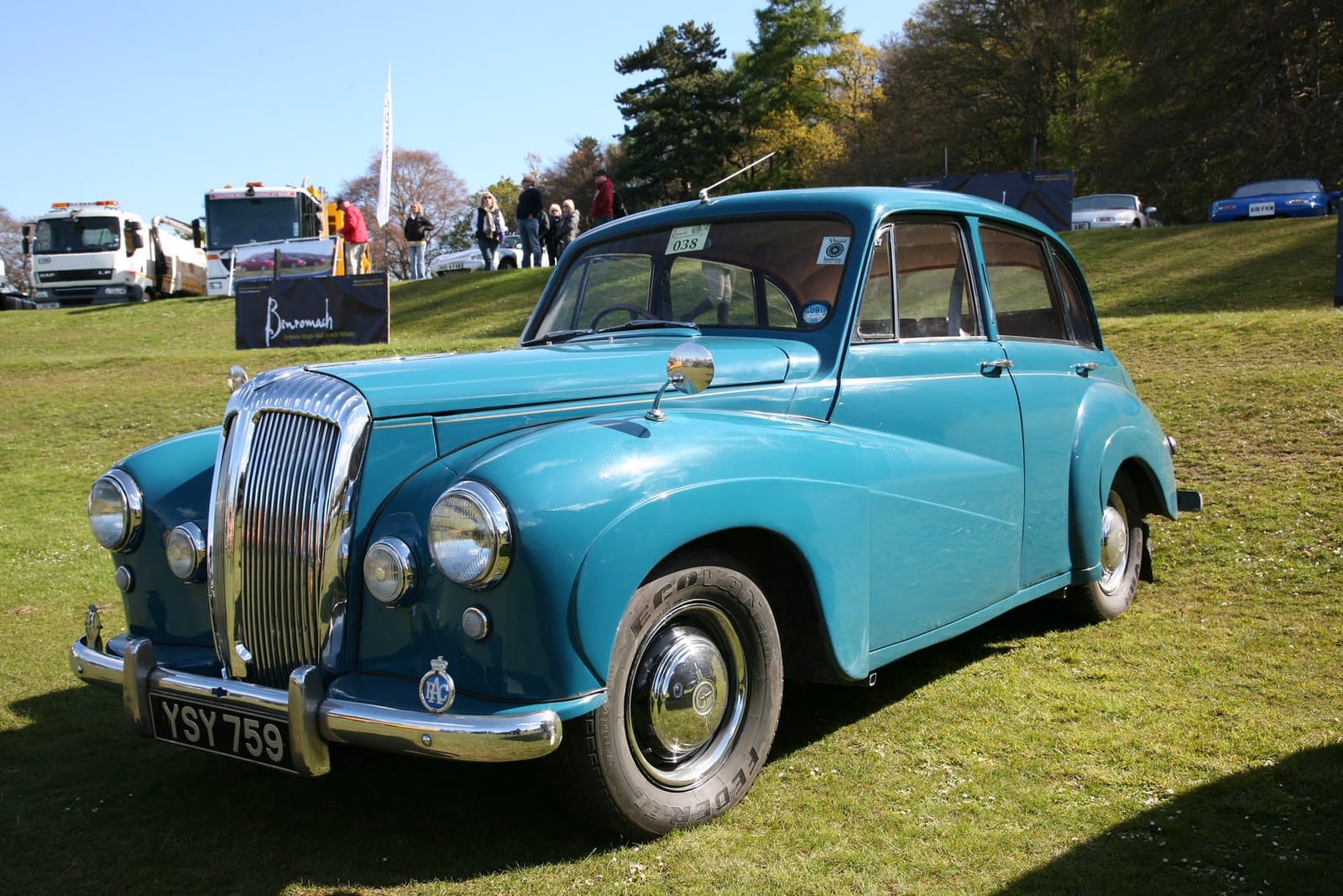 A turquoise Daimler Conquest on grass, front three-quarter view