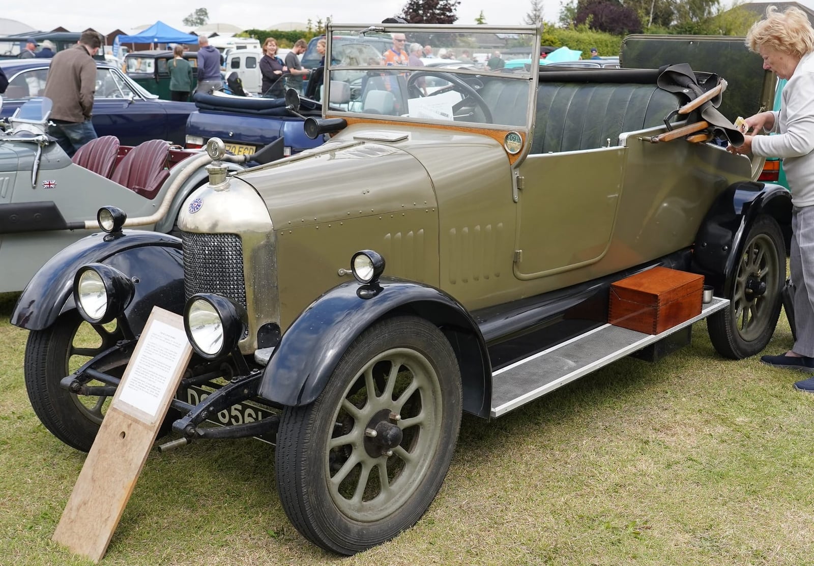 A 1925 Bullnose Morris open tourer with polished radiator and its windscreen frame upright, front three-quarter view at a classic car show