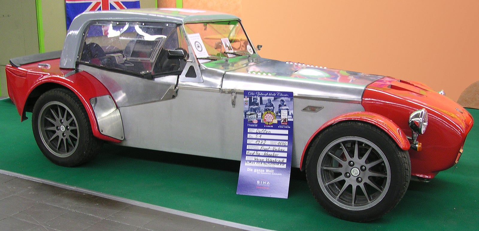 A silver Dutton open roadster photographed from the rear