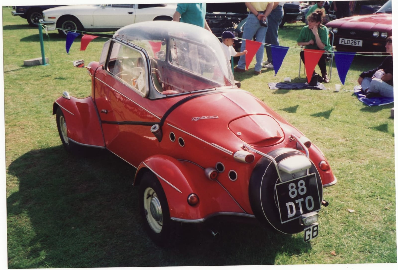 The rear three-quarter of a red FMR Tg500 Messerschmitt Tiger four-wheeler, UK registration 88 DTO