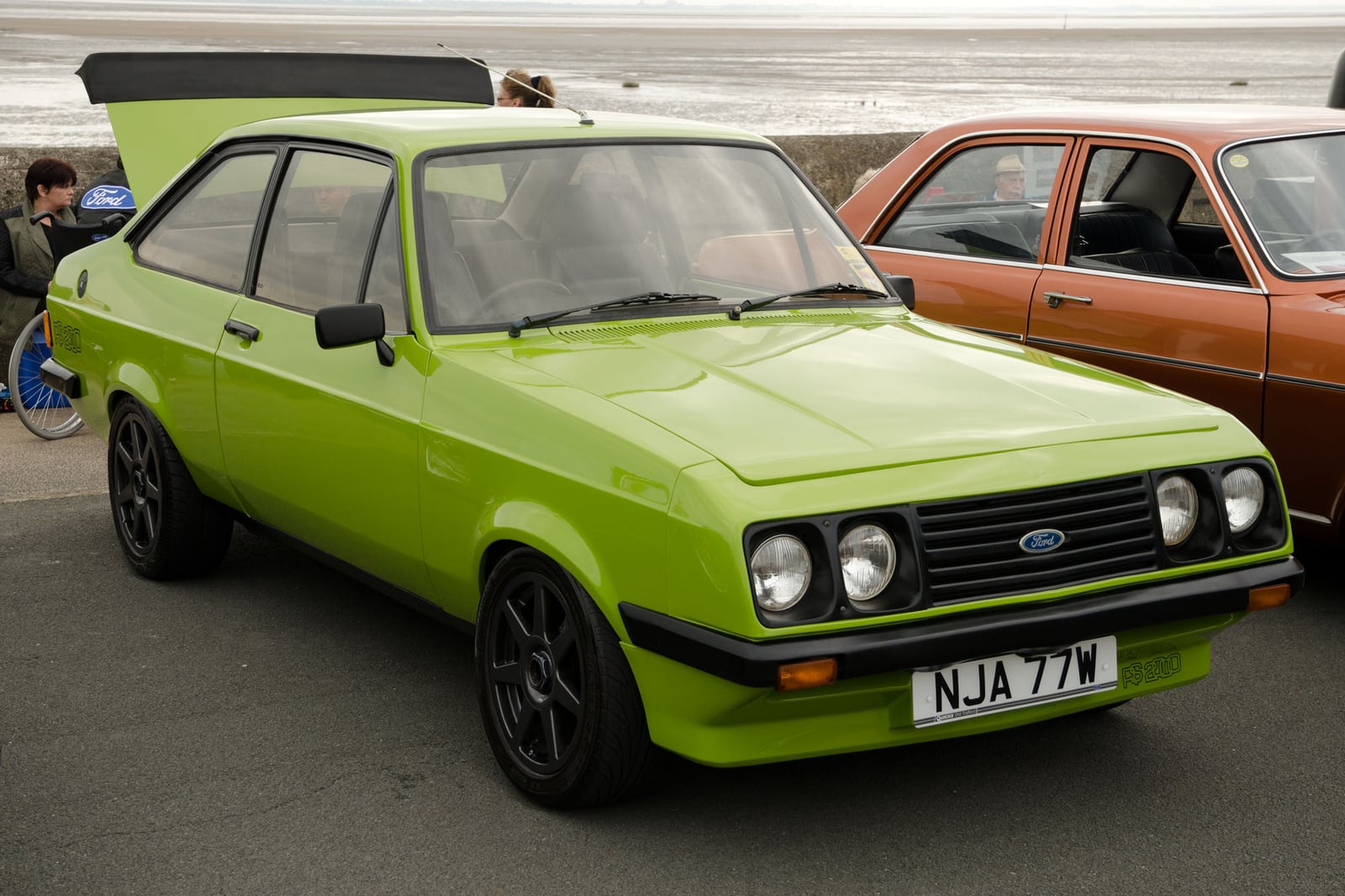 A green Mk2 Ford Escort RS2000, front three-quarter view