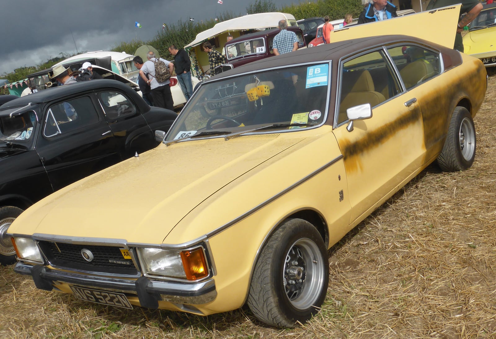 A cream Ford Granada Mk1 coupe at a classic car show, front three-quarter view