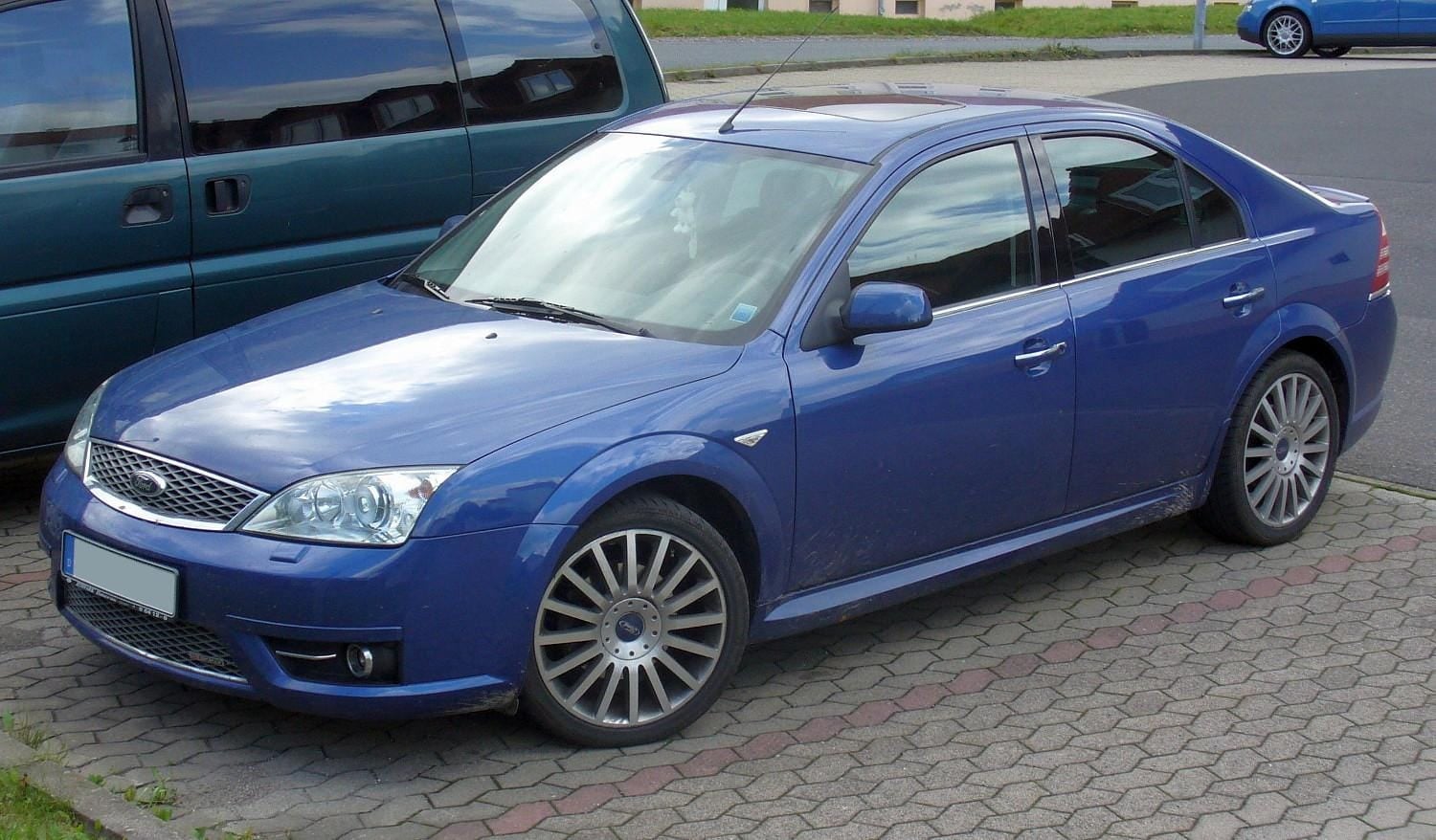 A Performance Blue Ford Mondeo ST220 saloon, side view, showing the lowered stance and multi-spoke wheels