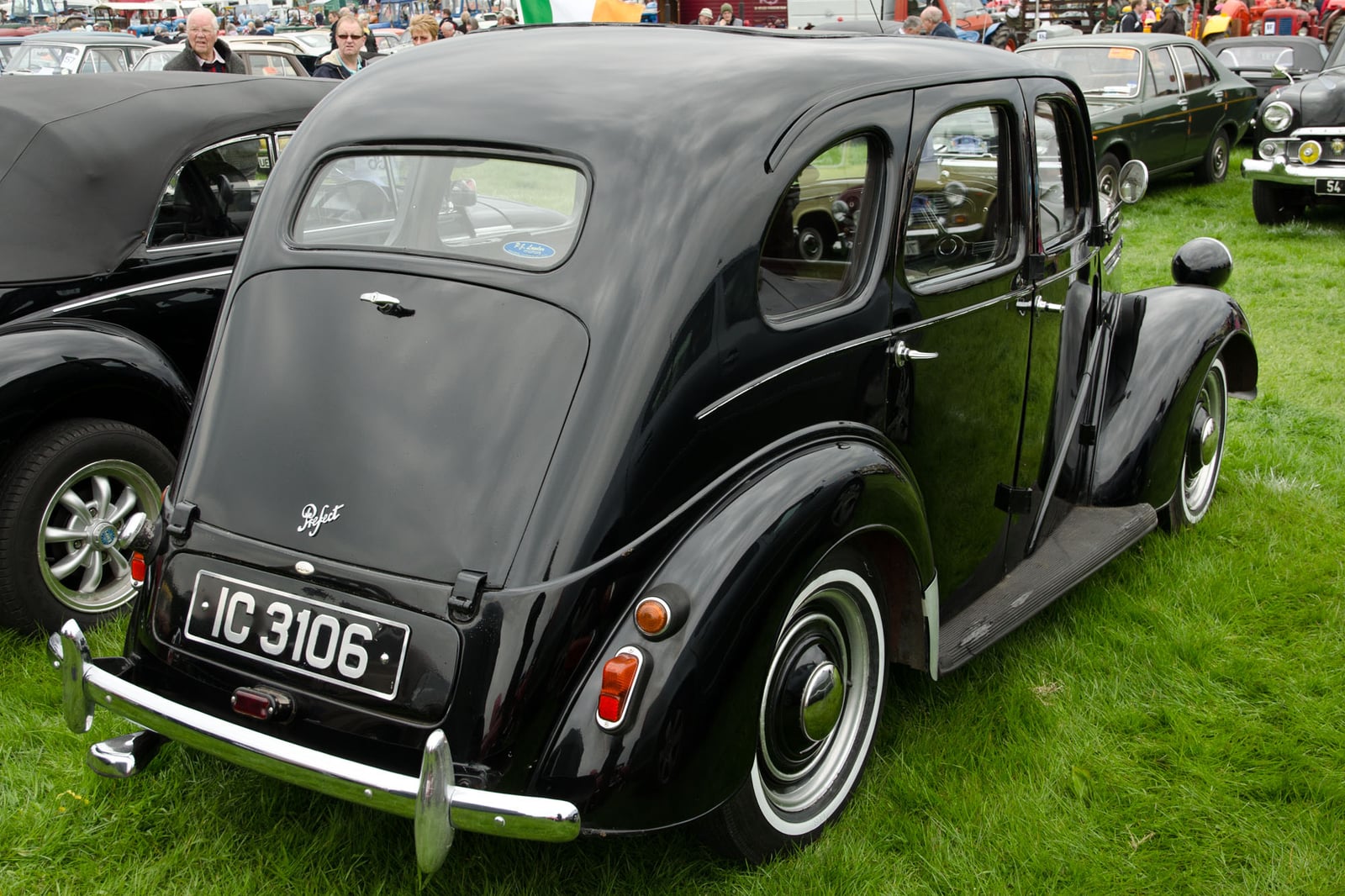 A black upright Ford Prefect E93A saloon at a show, rear three-quarter view