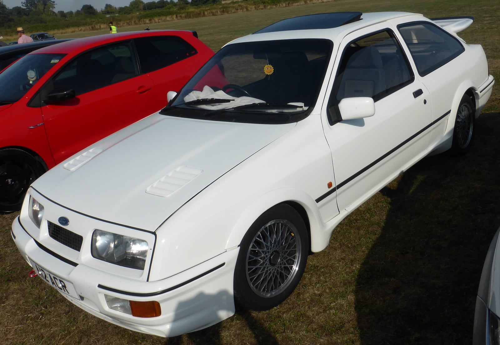 A black three-door Ford Sierra RS Cosworth at a show