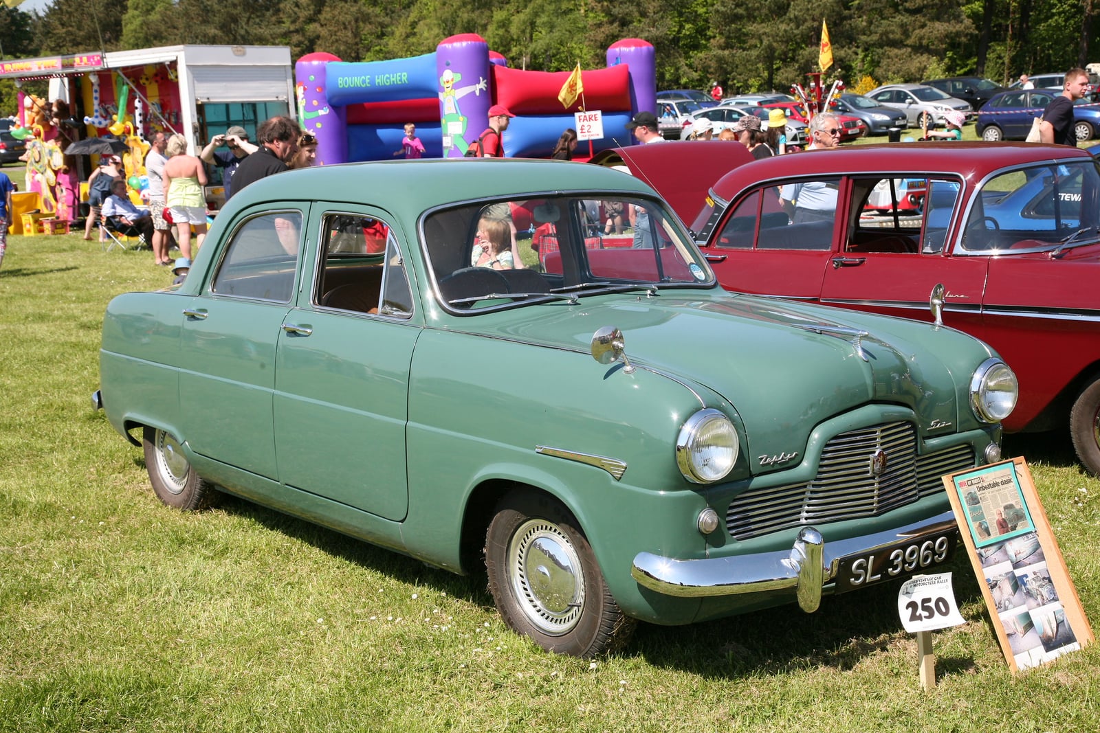 A green-and-cream Ford Zephyr Six saloon at a show, front three-quarter view