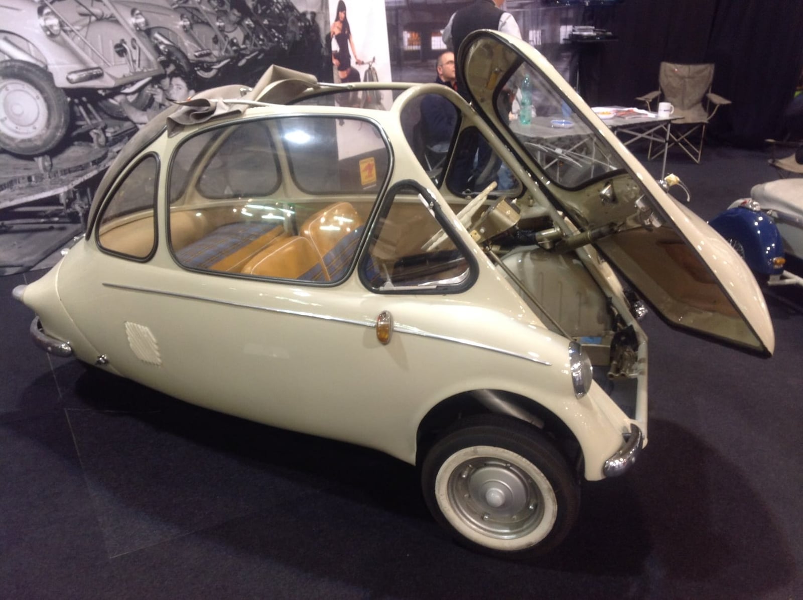 A pale blue Heinkel Kabine on indoor display, rear three-quarter view showing the cooling louvres