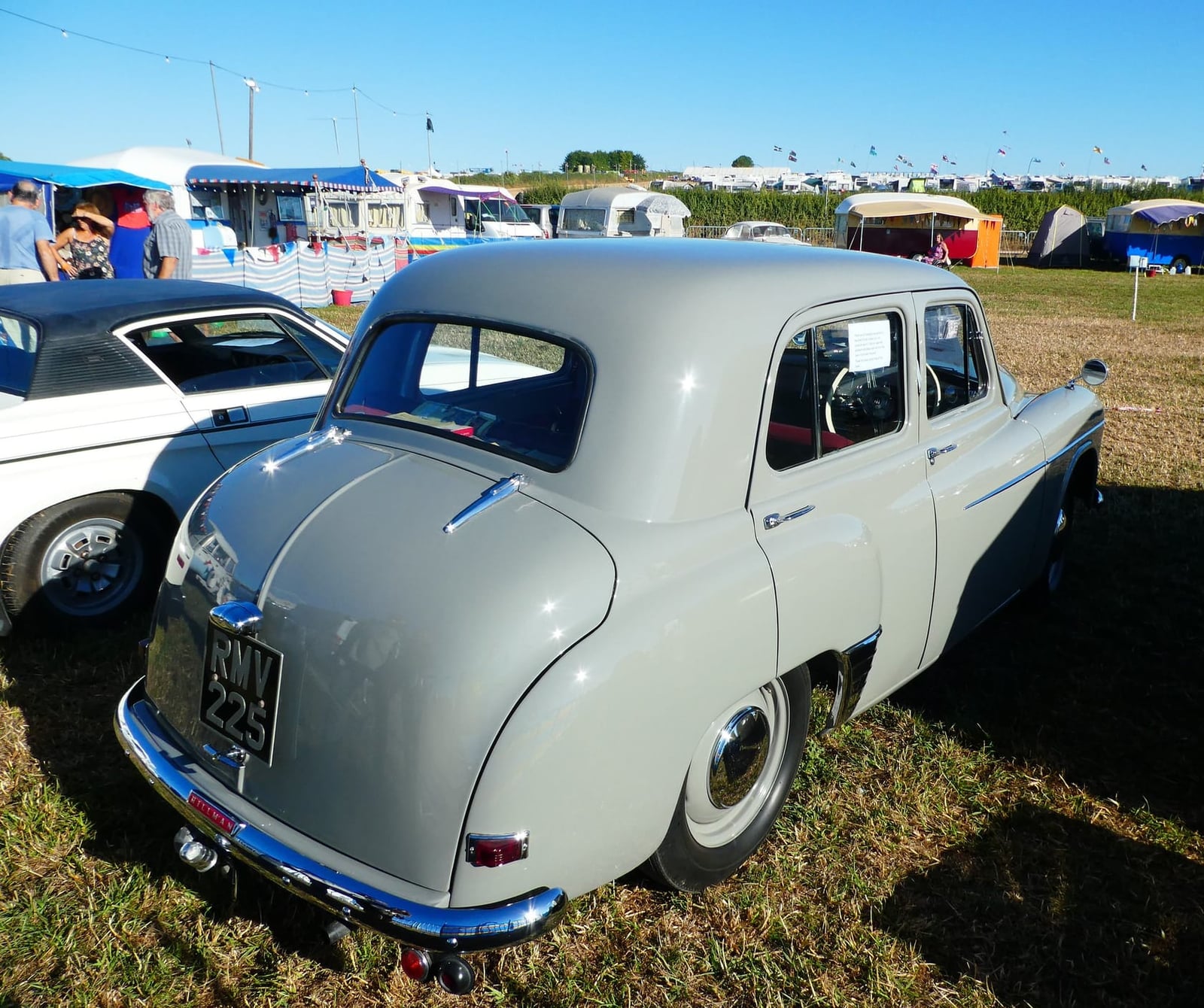 The rear of a grey 1952 Hillman Minx Mk V on grass