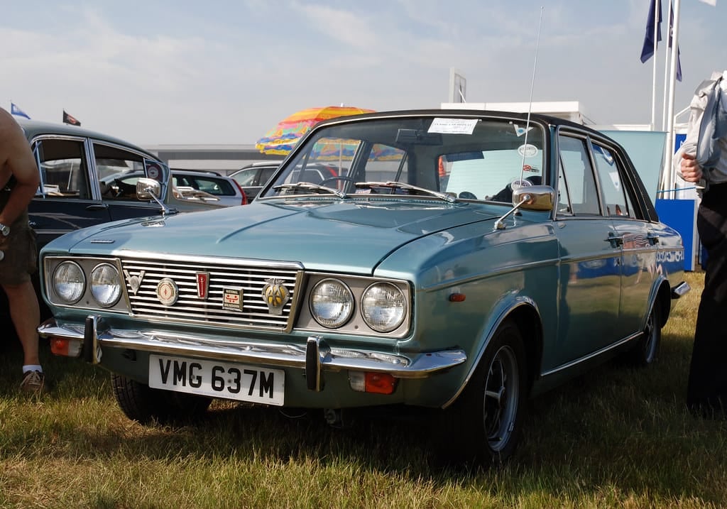 A blue-green Humber Sceptre Mk III with four headlamps on grass at a coastal classic car show, UK registration VMG 637M