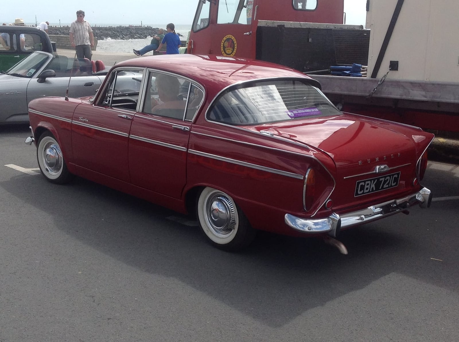 The front of a dark green 1965 Humber Sceptre Mk I showing its four headlamps, badges and grille, UK registration CMD 187A
