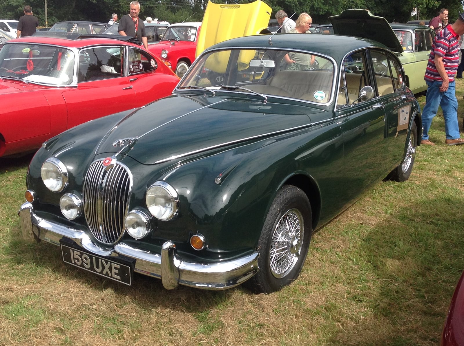 A green Jaguar Mk2 3.4 saloon, front three-quarter view, at a classic car gathering