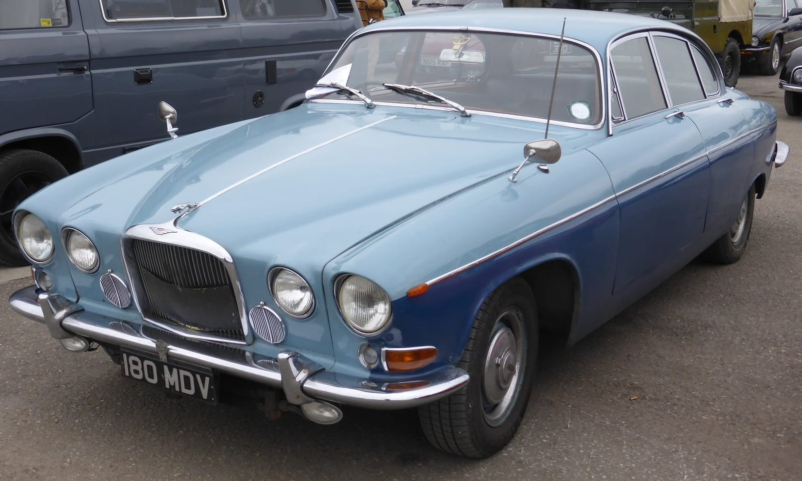 A period Jaguar range advertisement headed Grace, Space, Pace, showing the Mark X with other models