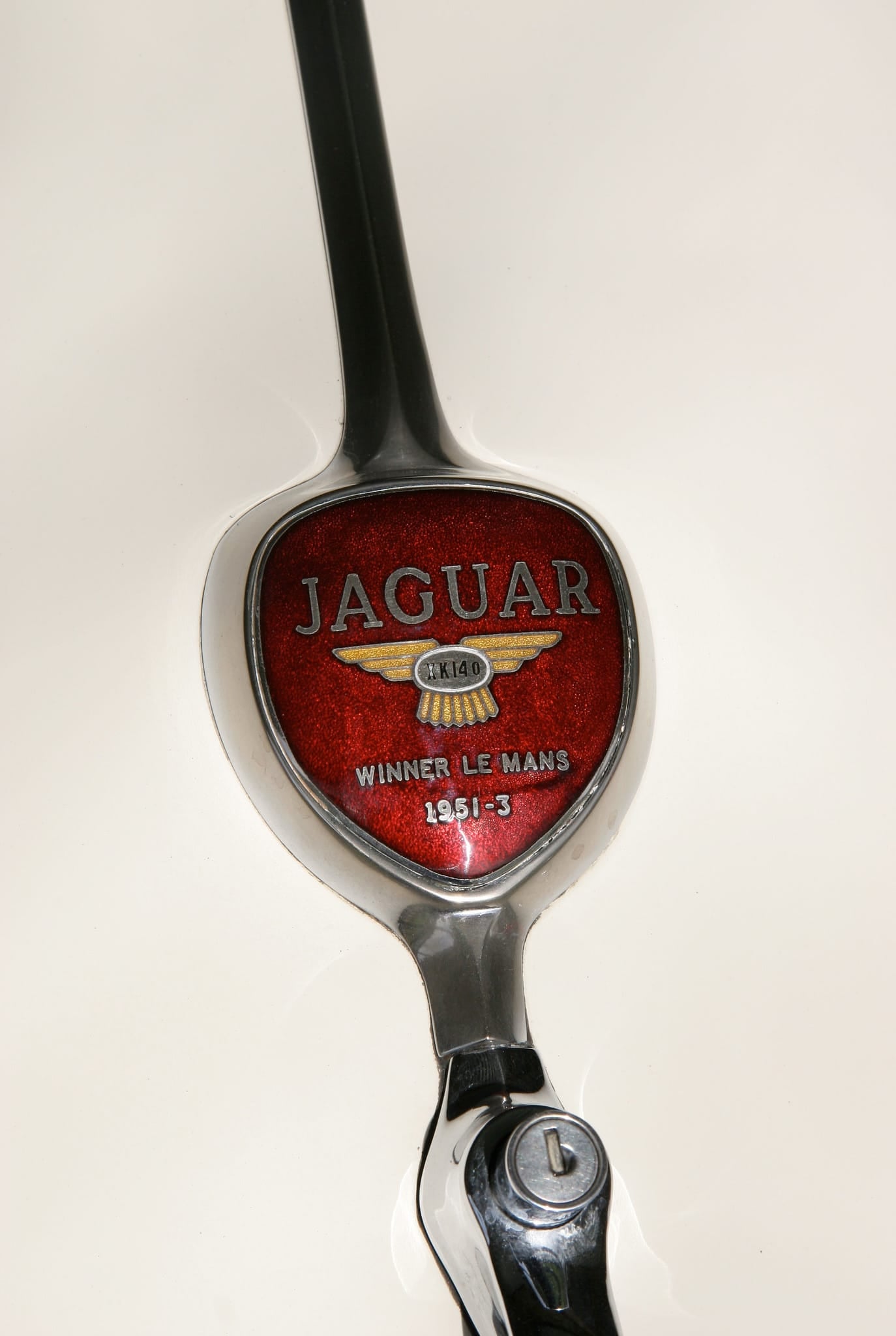 Close-up of a Jaguar bonnet badge commemorating the marque's Le Mans wins