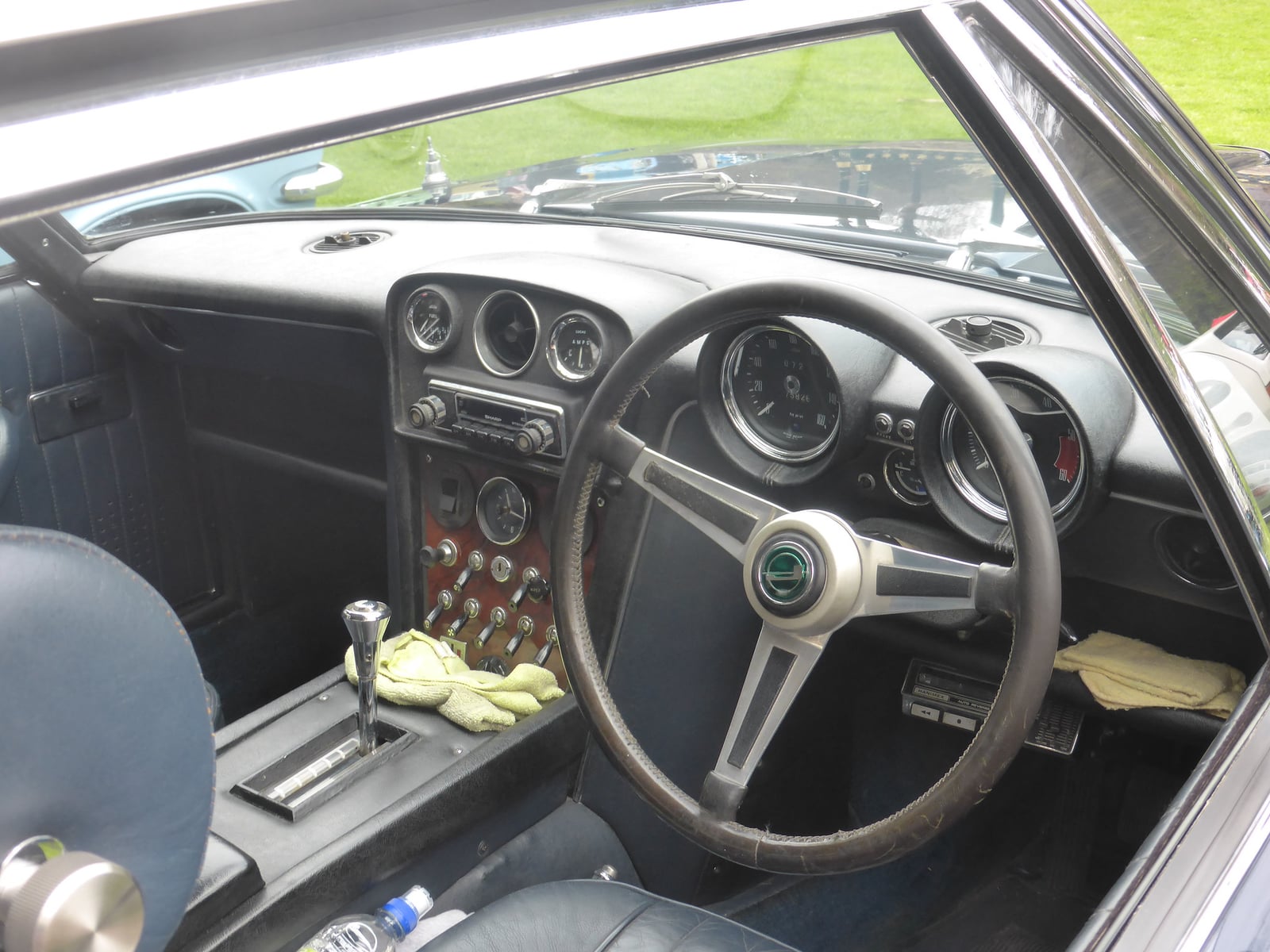 The dashboard and steering wheel of a Jensen FF