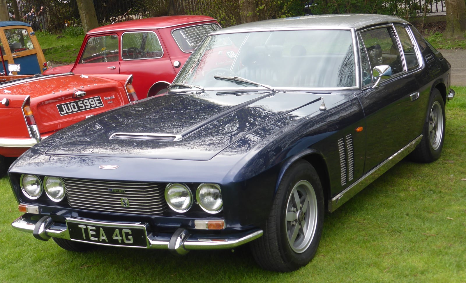 A dark blue Jensen FF at a show, front three-quarter view