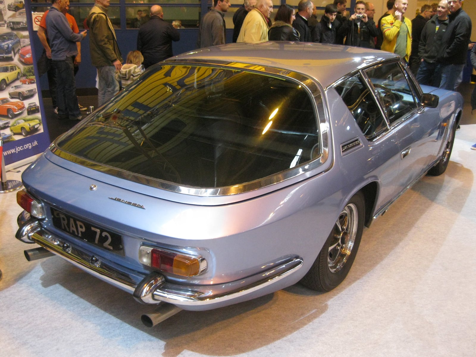 A silver Jensen Interceptor with a long bonnet, front three-quarter view