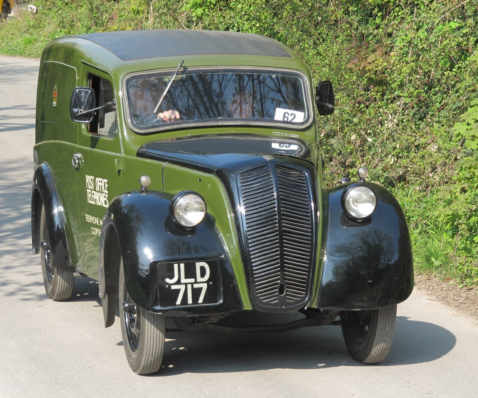 A green 1947 Morris Eight Series Z utility van in Post Office Telephones livery on a country road, UK registration JLD 717