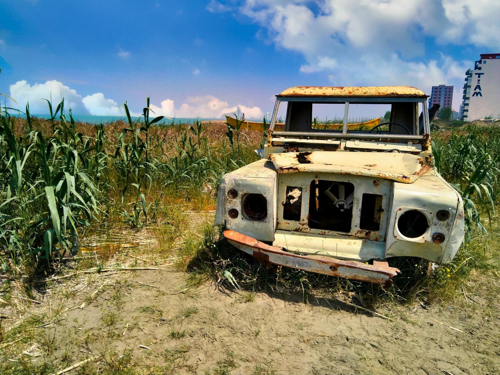 A stripped, rusting Land Rover Series shell awaiting restoration