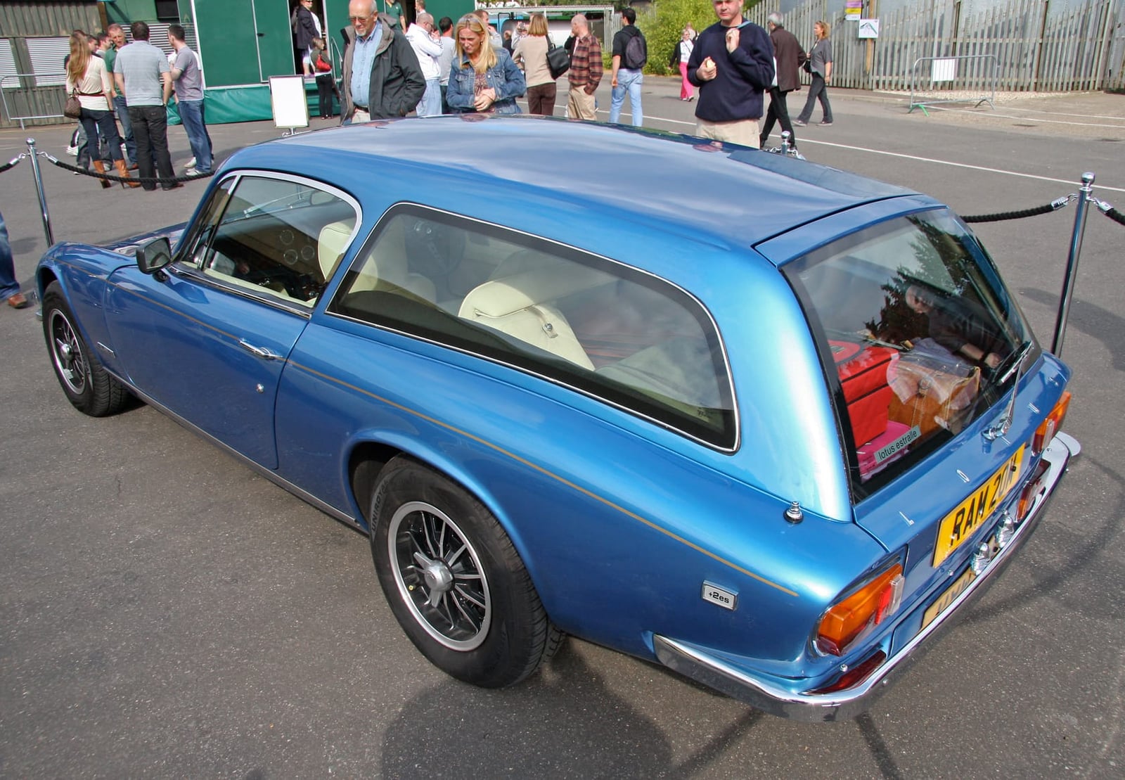 A blue Lotus Elan +2S 130/5 converted into a shooting brake, rear three-quarter view