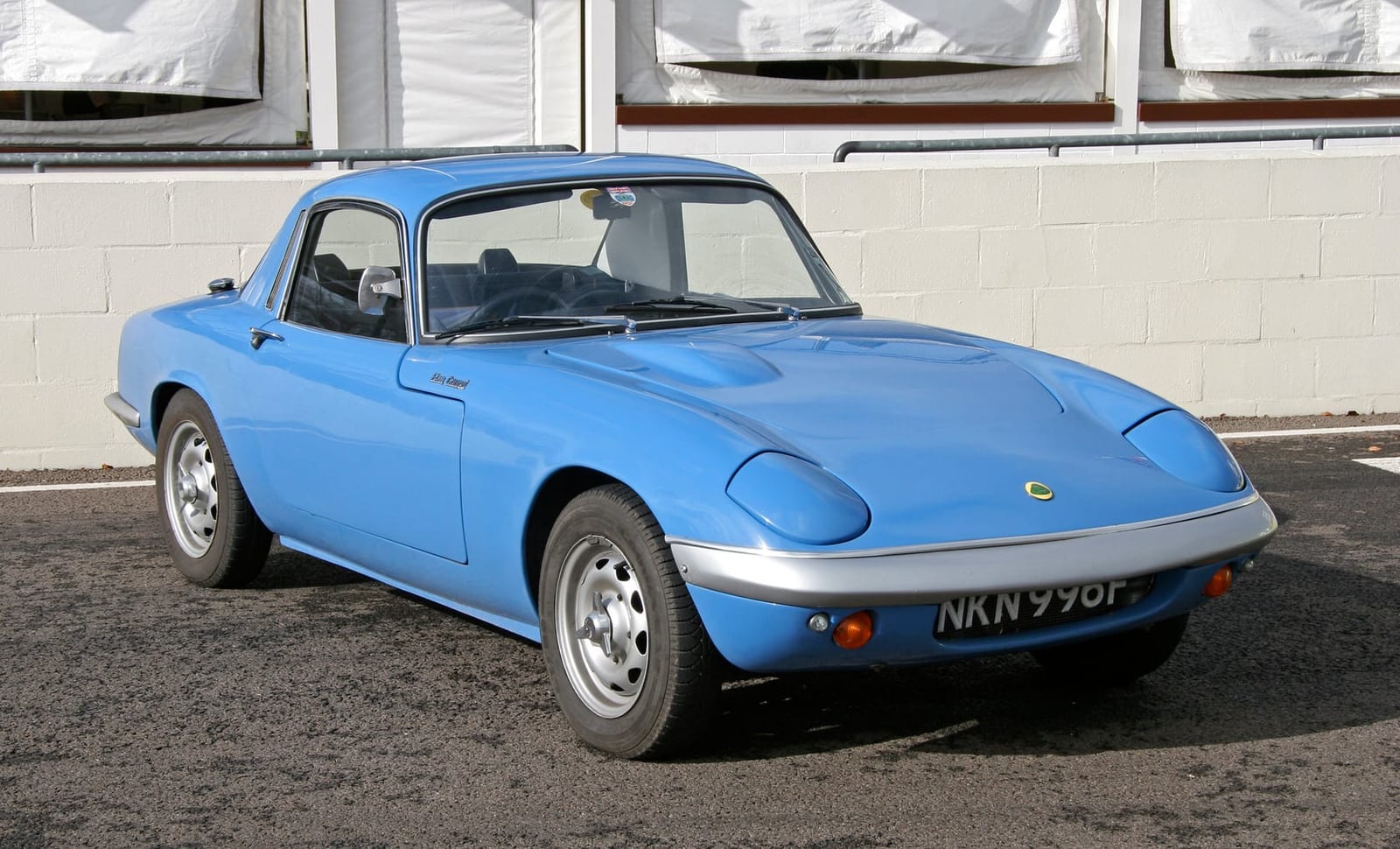 A pale blue Lotus Elan fixed-head coupe, front three-quarter view, UK registration NKN 996F