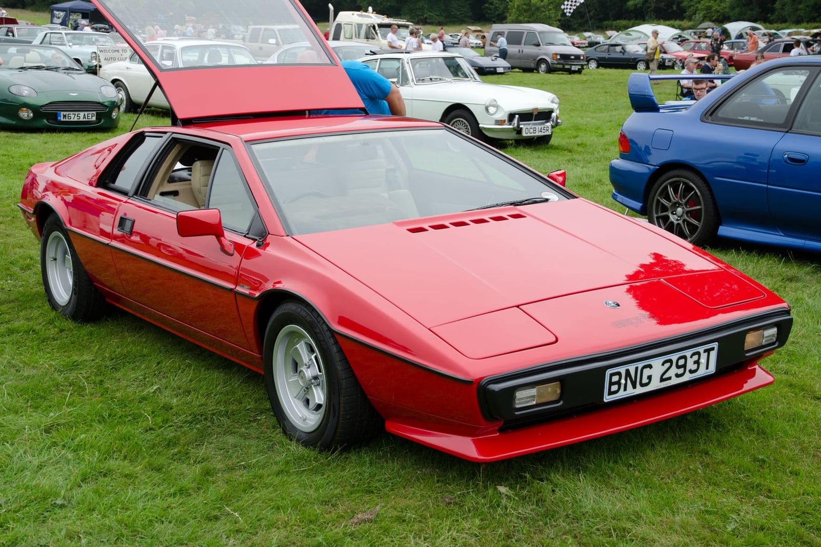 The rear of a white 1978 Lotus Esprit S2 with its glass hatch raised, UK registration TAC 101R