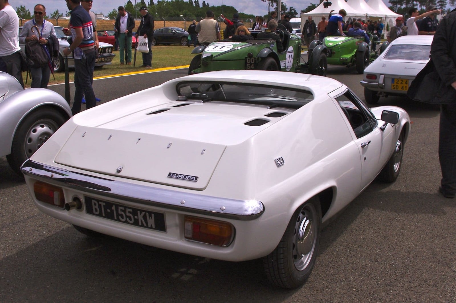 The rear three-quarter view of a white Lotus Europa S2 showing the flat sail panels of the bread-van tail