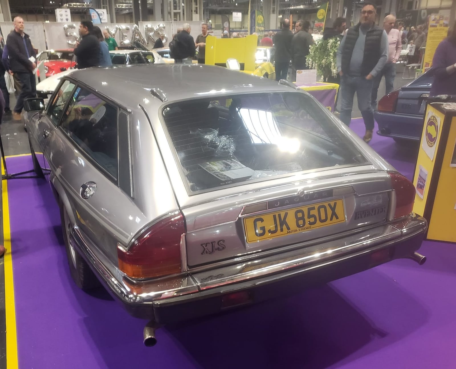 A silver 1982 Lynx Eventer, the estate-bodied Jaguar XJ-S conversion, displayed at an indoor classic car show with a UK registration