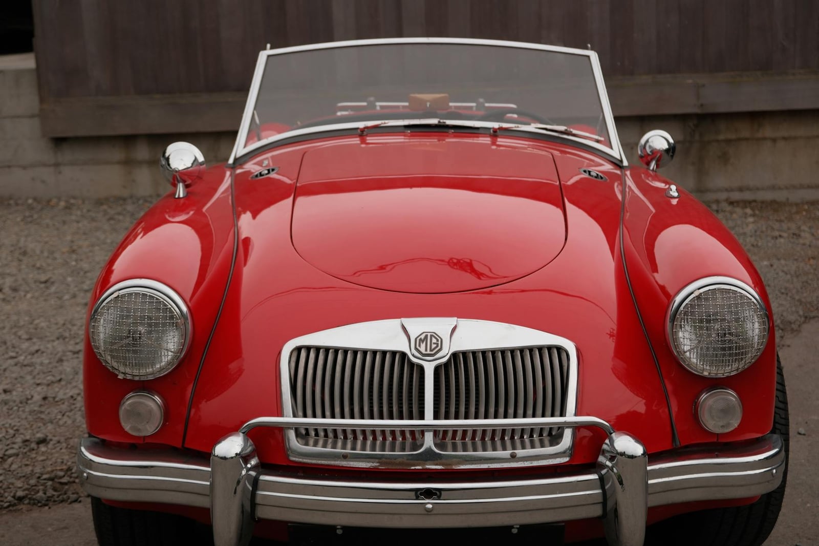 A red MG MGA roadster, front three-quarter view