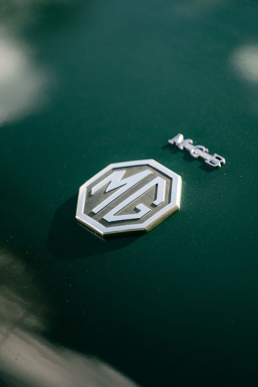 Close-up of the MG octagon badge on the bonnet of an MGB