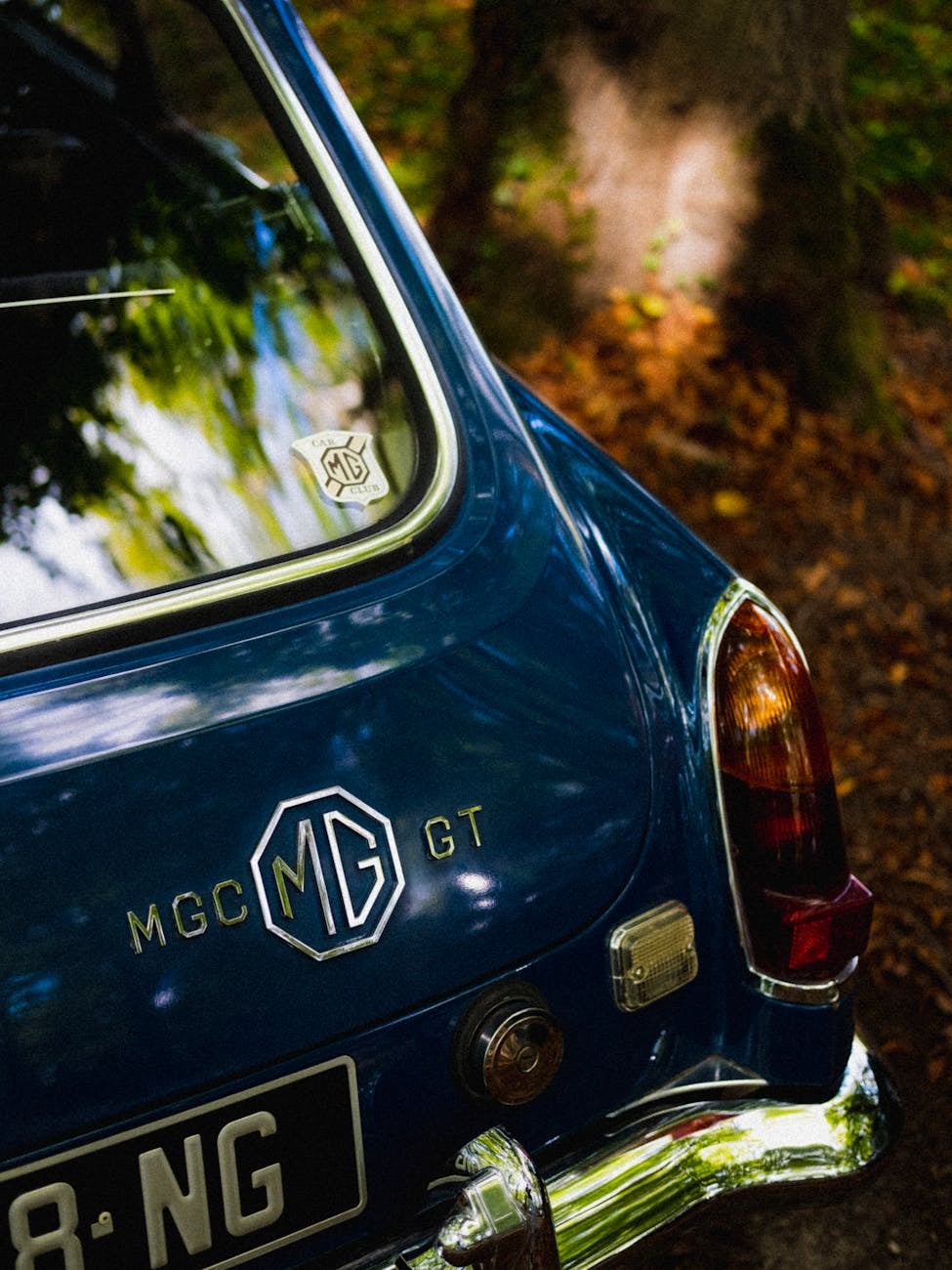 Close-up of the MGC GT badge on the rear of a blue MG MGC