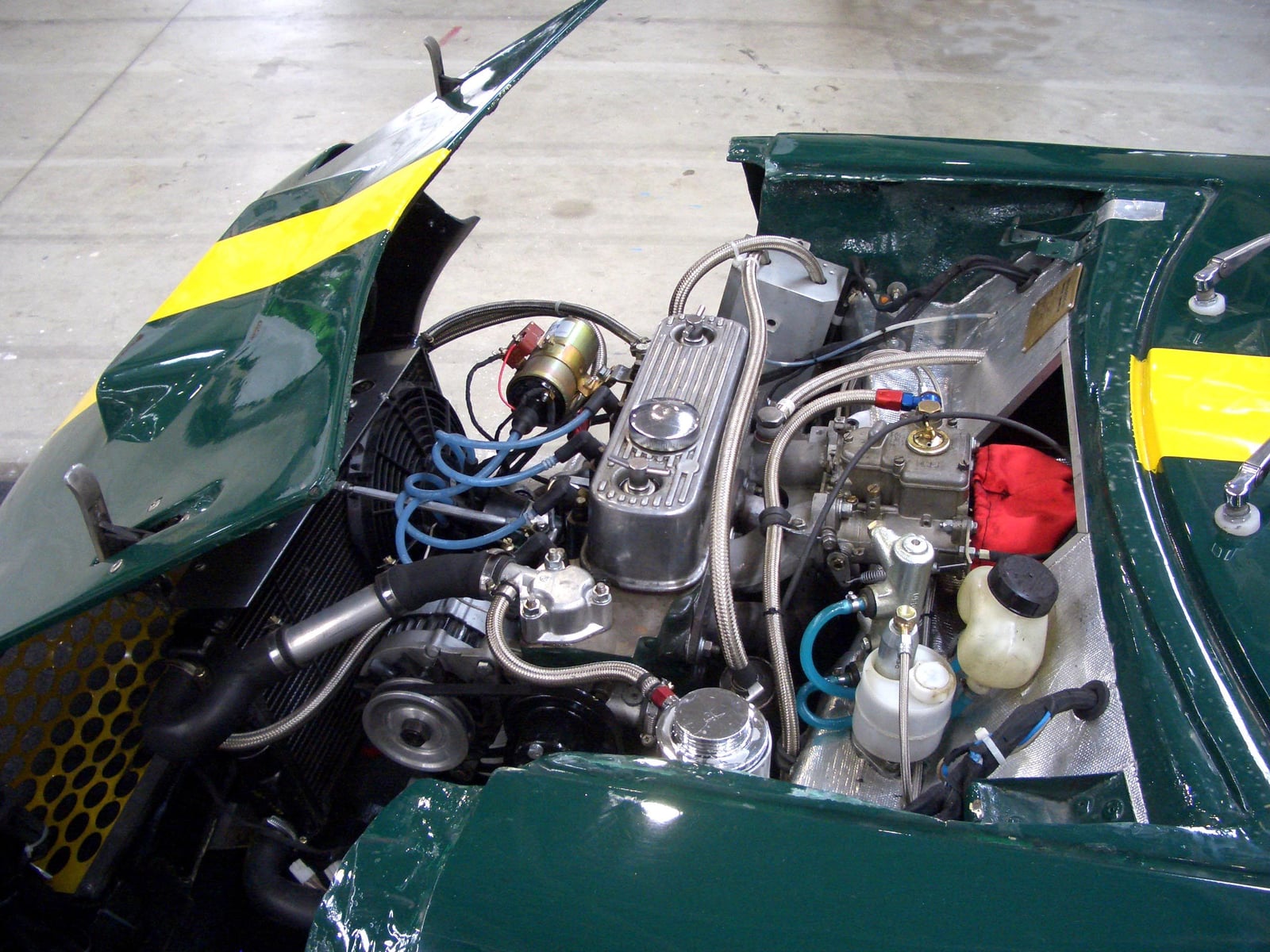 The engine bay of a Mini Marcos, showing the transverse Mini A-series engine and gearbox