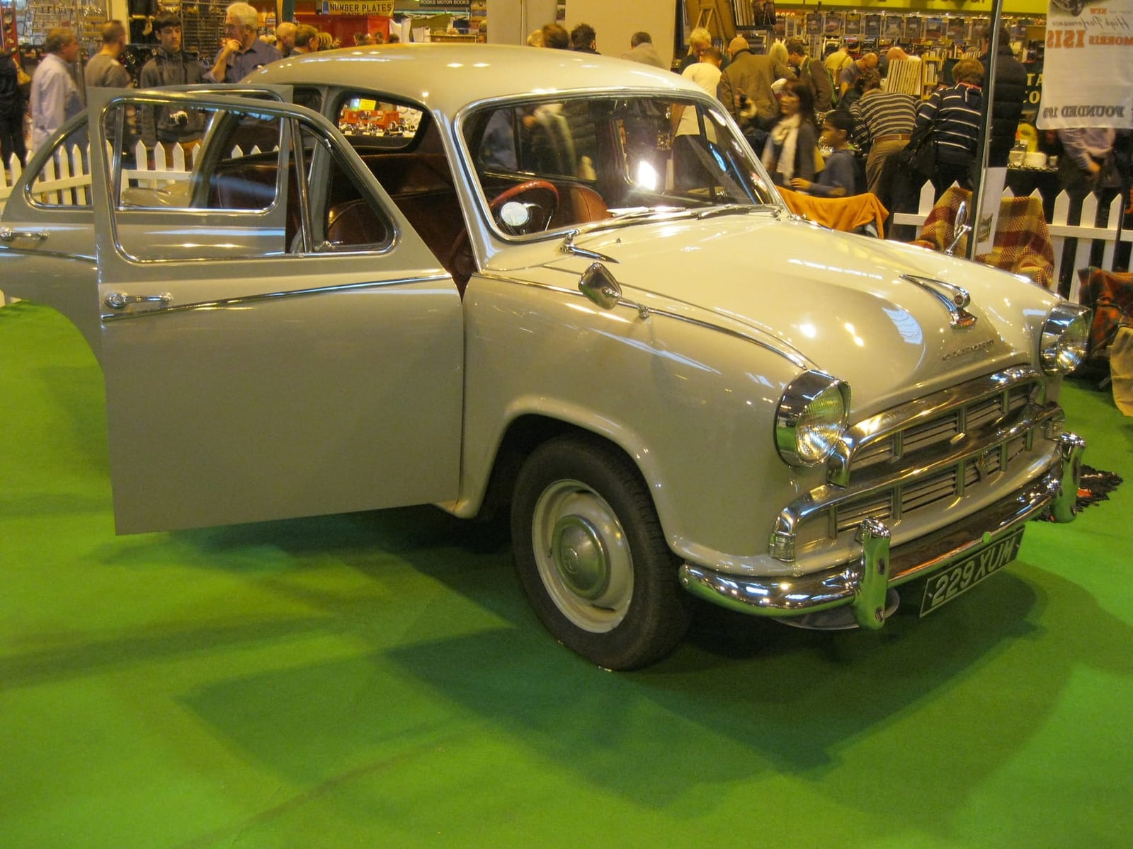A cream Morris Oxford Series III at an indoor classic car show, front three-quarter view, UK registration 229 XUM