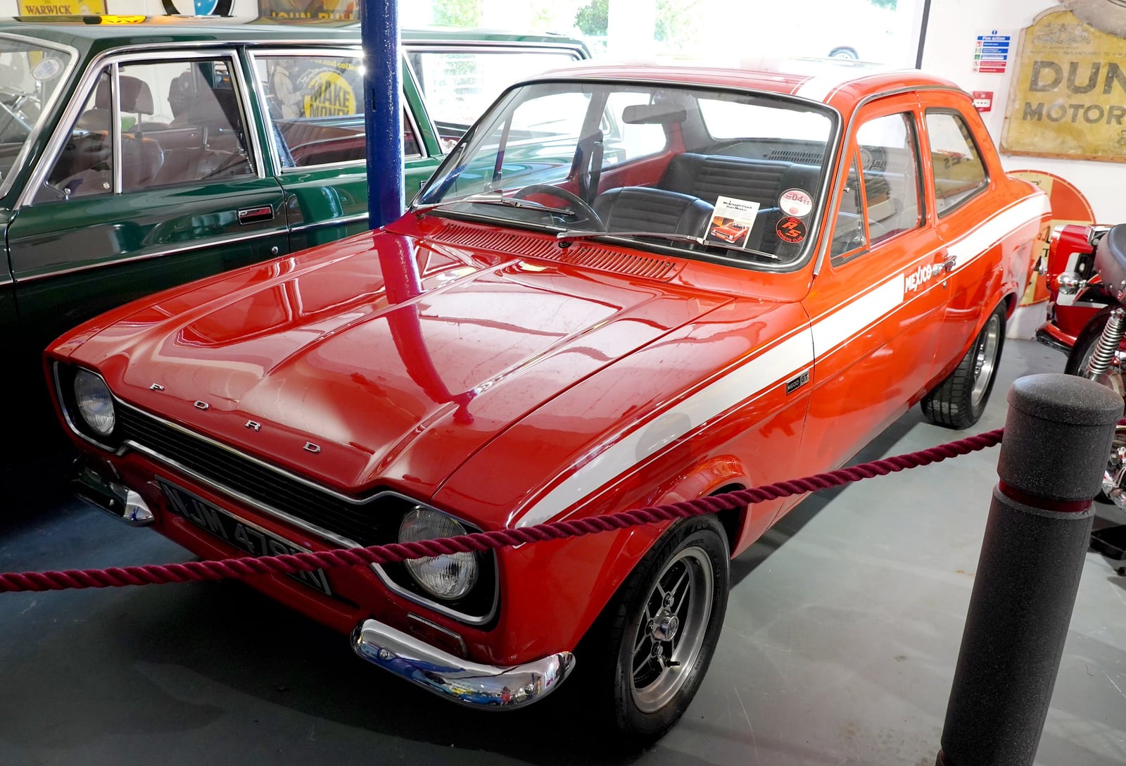 A red Mk1 Ford Escort Mexico on display, front three-quarter view