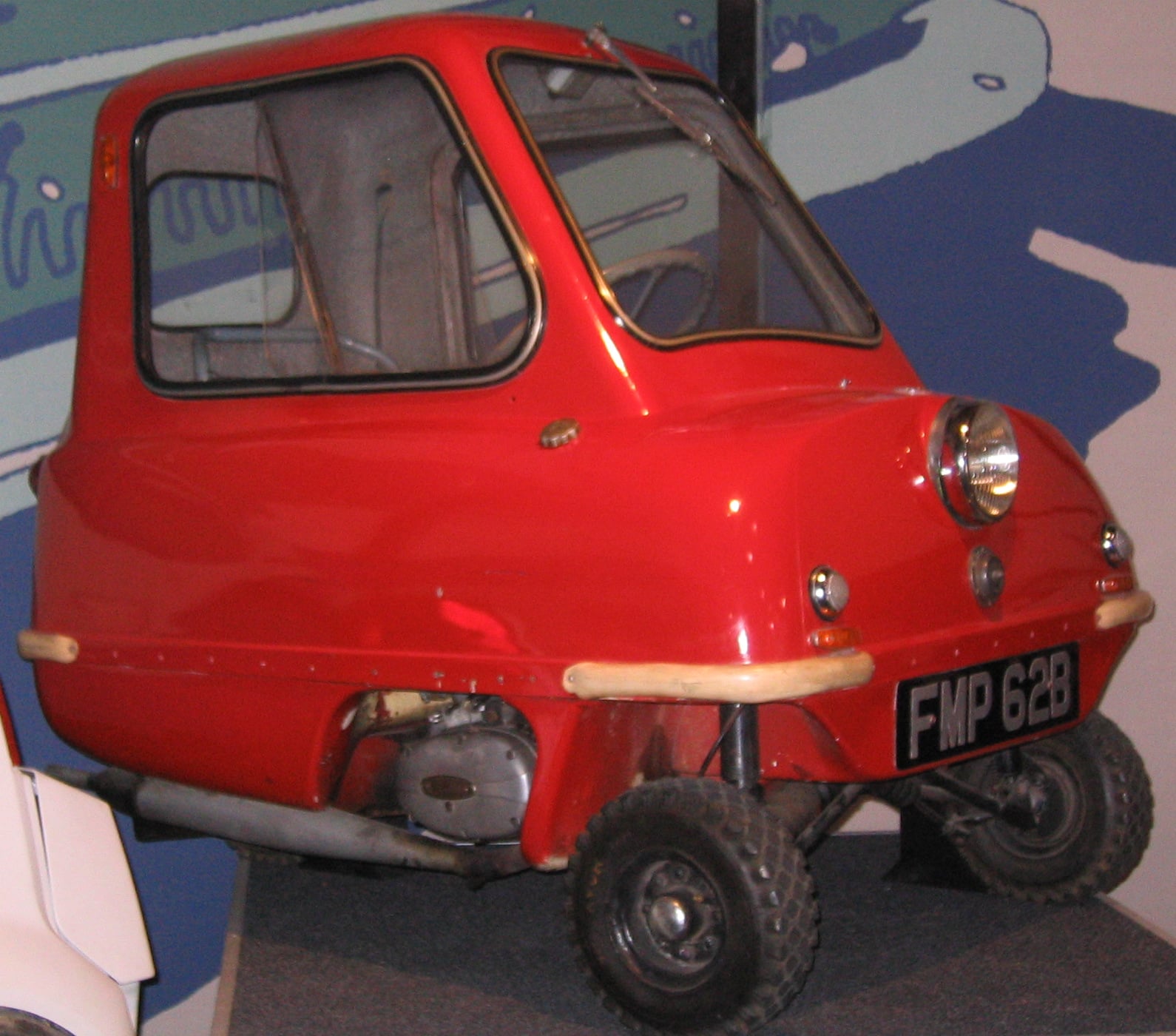 A red Peel P50 on display at the National Motor Museum, Beaulieu, front three-quarter view