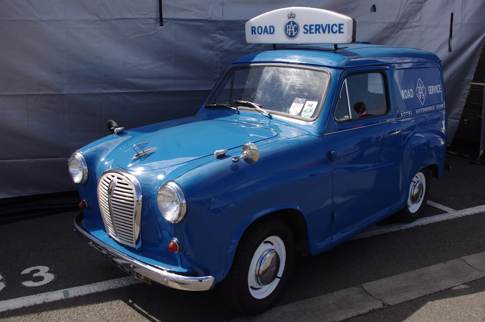 A blue Austin A35 van in RAC Road Service livery with a roof sign