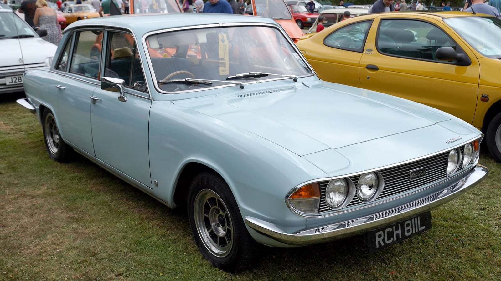 A light blue Triumph 2000 at a classic car gathering, front three-quarter view, UK registration RCH 811L