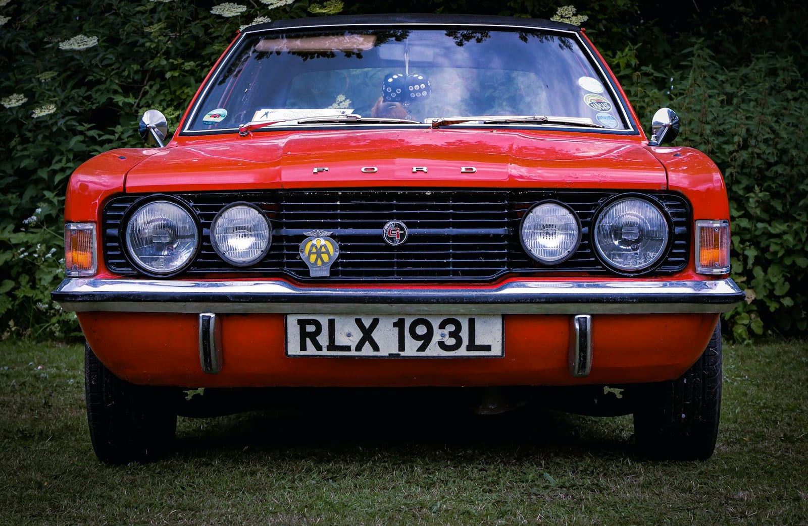 A red Ford Cortina Mk3, head-on front view