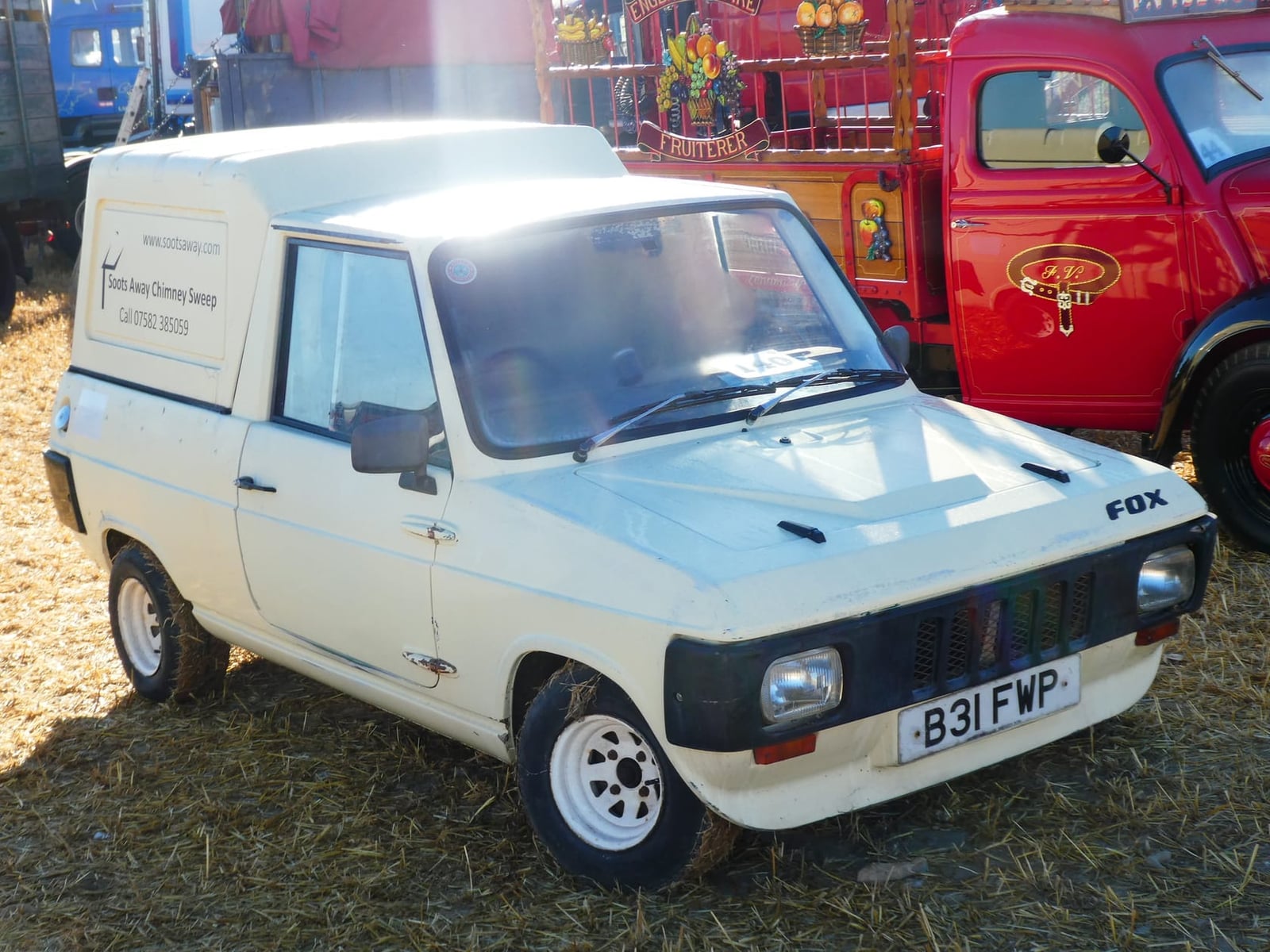 A pale blue 1984 Reliant Fox with hard rear top, front three-quarter view, UK registration B31 FWP