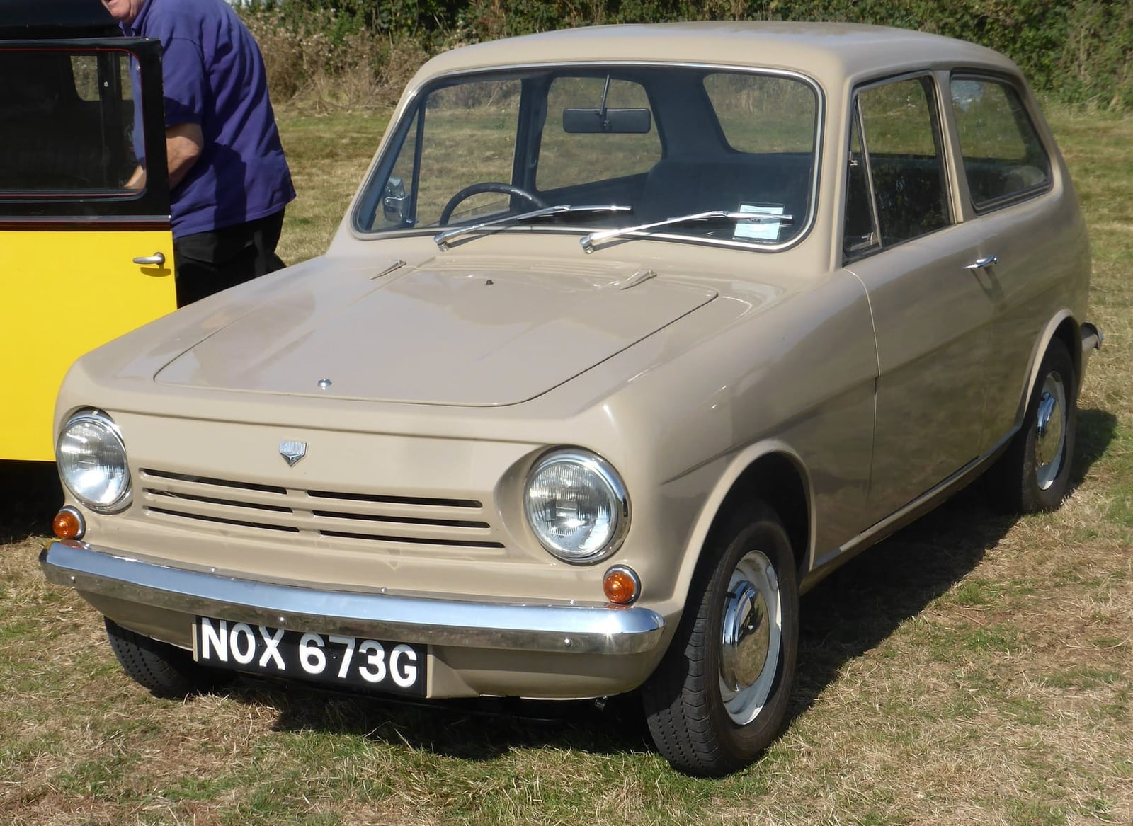 A beige 1968 Reliant Rebel 700, front three-quarter view, UK registration NOX 673G
