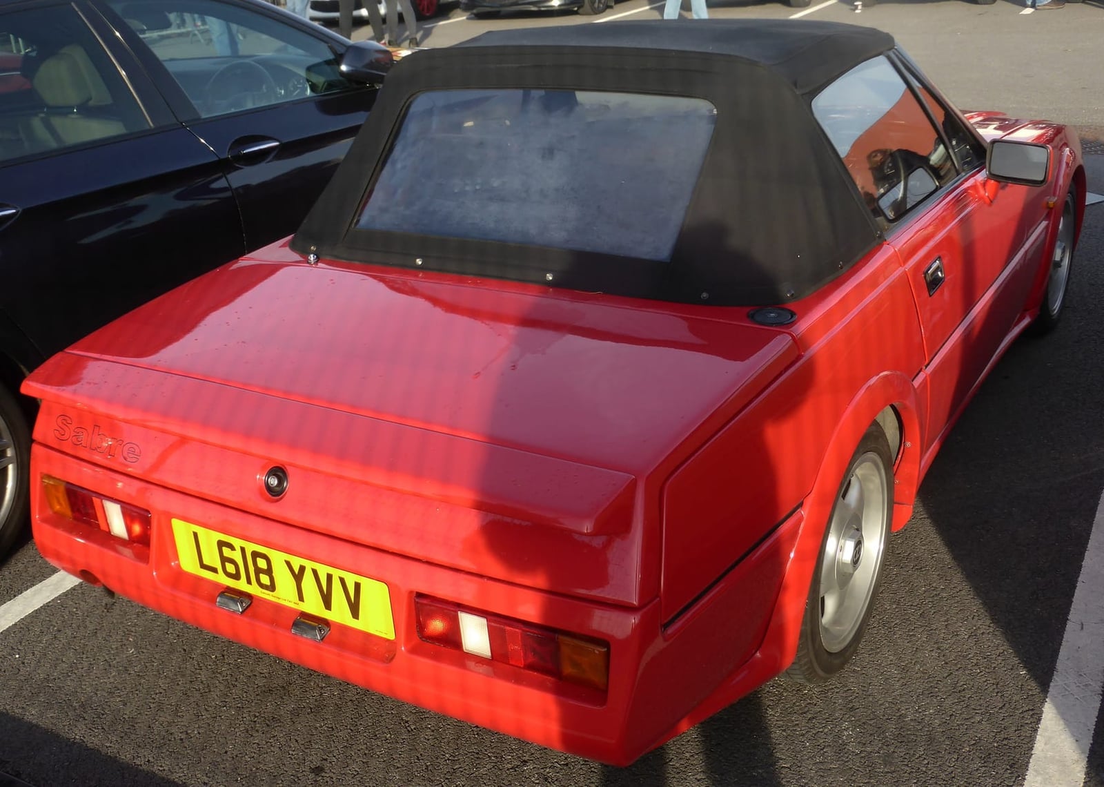 The rear of a red Reliant Scimitar Sabre showing the tail panel and hood, UK registration L618 YVV