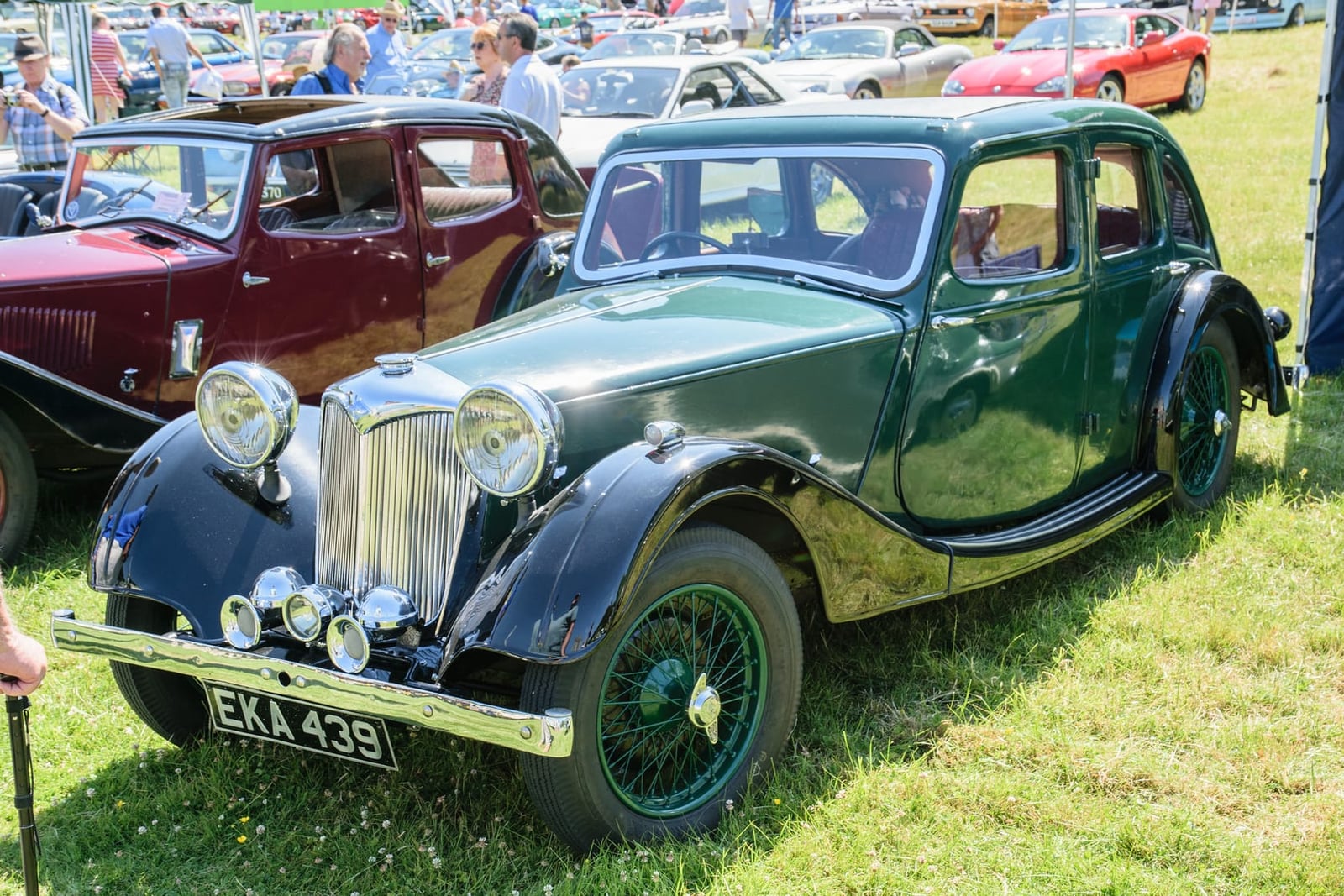 A green 1938 Riley 1.5-litre Kestrel on grass at a classic vehicle show, front three-quarter view, UK registration EKA 439
