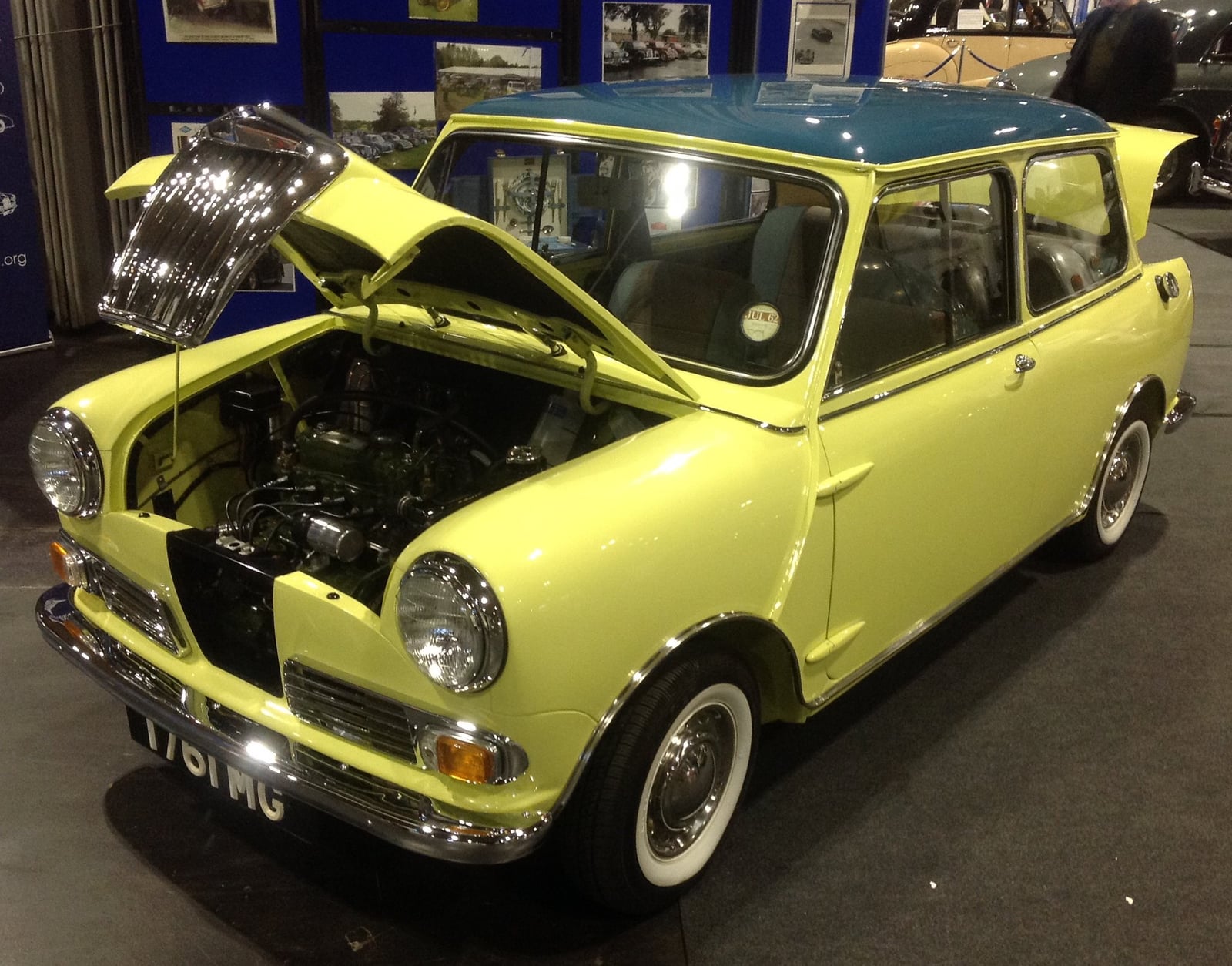 A yellow Riley Elf with the bonnet open, front three-quarter view