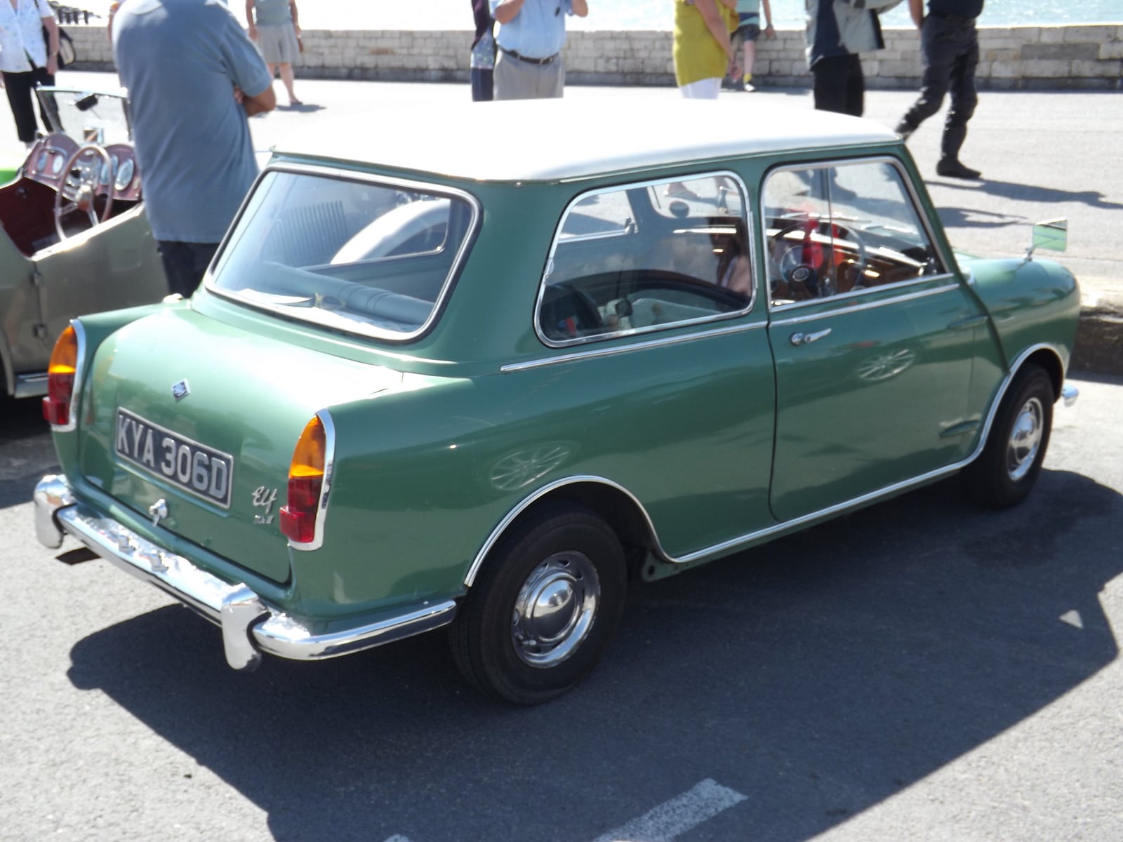 A green Riley Elf at a seaside show, rear three-quarter view showing the extended boot