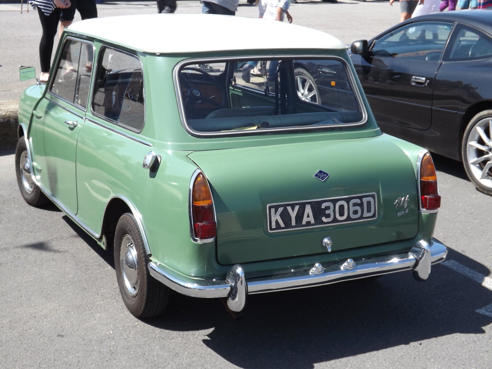 A green Riley Elf at a seaside show, rear three-quarter view