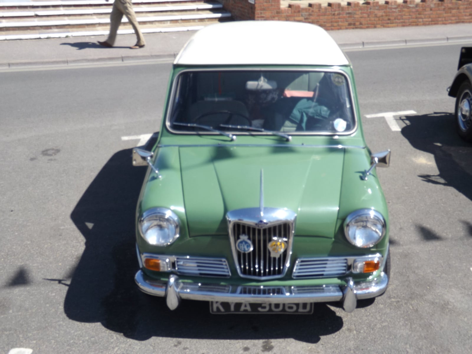A green Riley Elf saloon at a seaside show, front three-quarter view