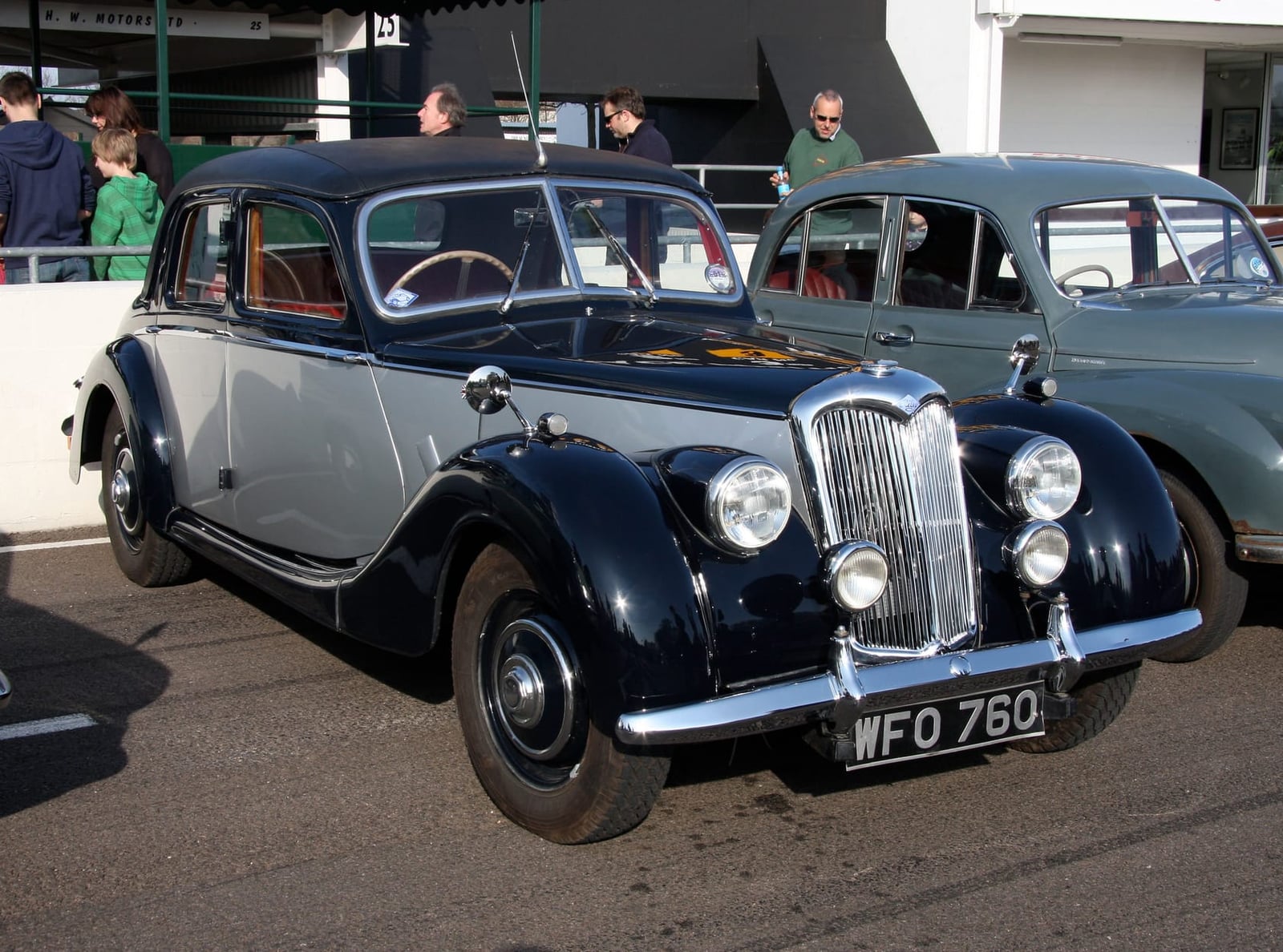 A dark blue Riley RMA saloon parked outdoors, front three-quarter view, UK registration WFO 760