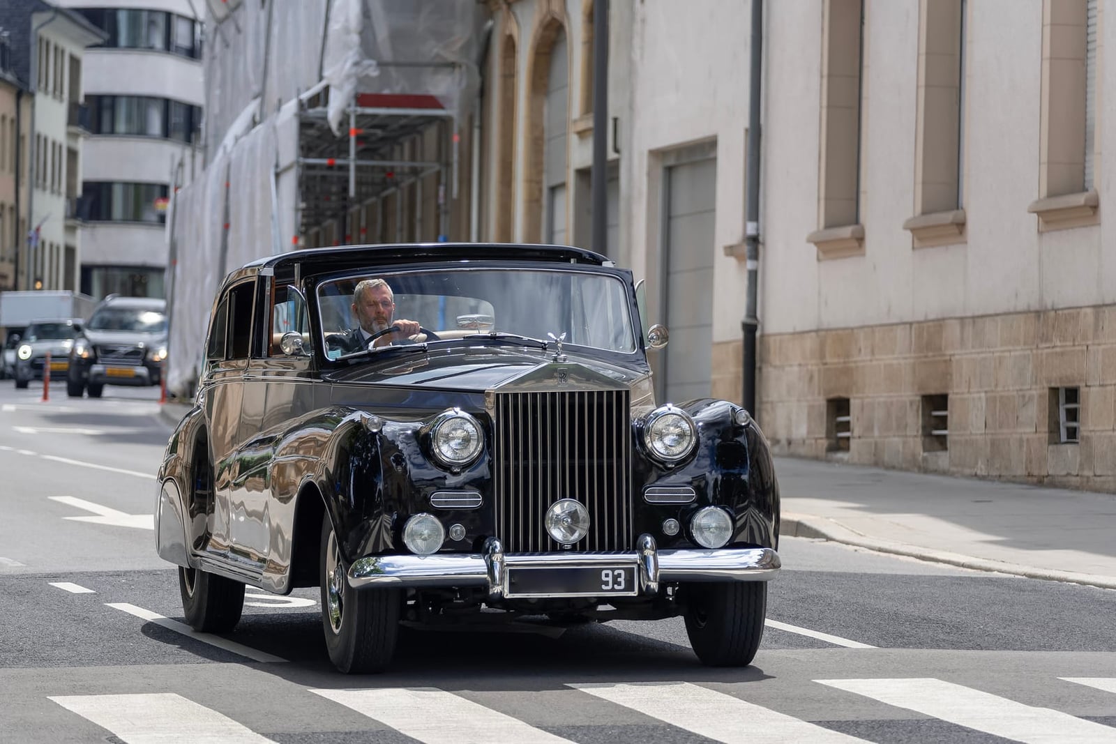 A Rolls-Royce Silver Wraith crossing a city zebra crossing