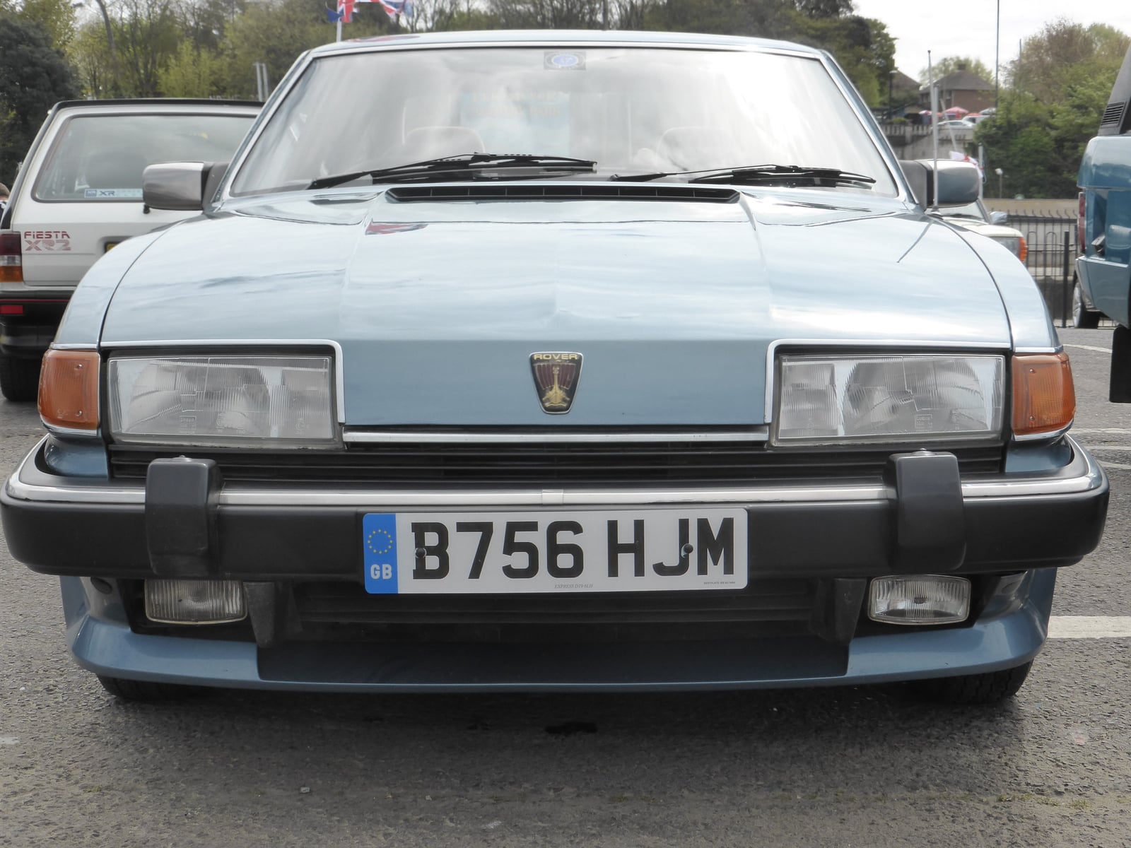 A light blue Rover SD1 Vanden Plas, front view, showing the Rover badge and wedge-shaped nose
